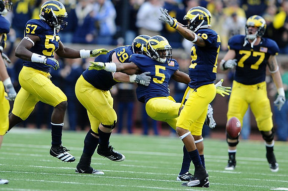 Frank Clark (57), Will Heininger (39), Courtney Avery (5), Roy Roundtree (12), and Taylor Lewan (77)