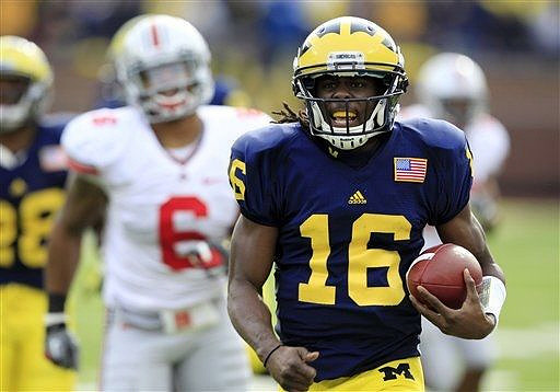 Denard Robinson (16) and Fitzgerald Toussaint (28)