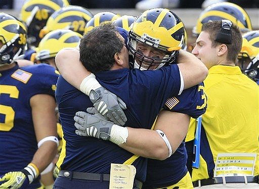 Joe Kerridge (36), Brady Hoke, and Will Heininger (39)
