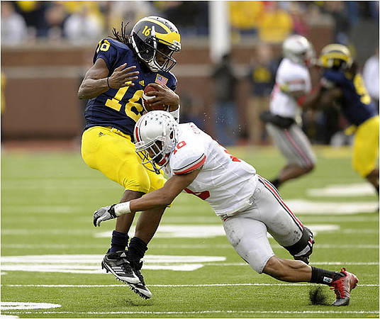 Denard Robinson (16) and Martavious Odoms (9)