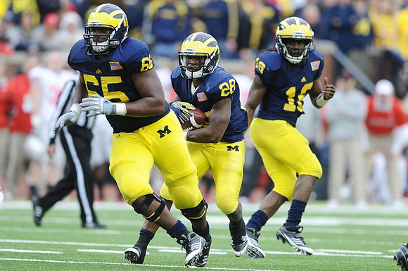Patrick Omameh (65), Fitzgerald Toussaint (28), and Denard Robinson (16)