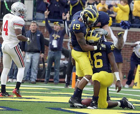 Kelvin Grady (19) and Denard Robinson (16)