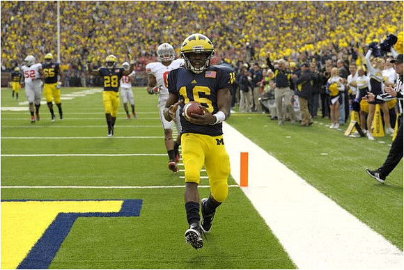 Patrick Omameh (65), Fitzgerald Toussaint (28), and Denard Robinson (16)
