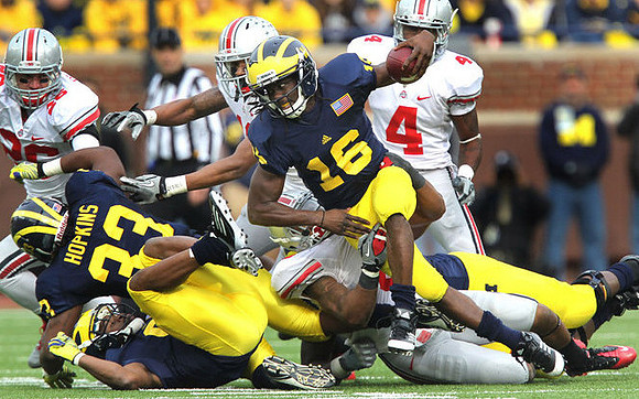 Stephen Hopkins (33) and Denard Robinson (16)