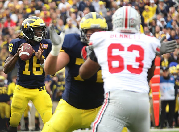 Denard Robinson (16) and Mark Huyge (72)