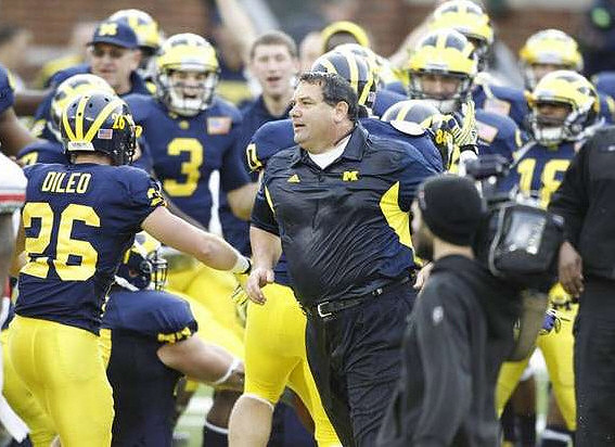 Drew Dileo (26), Russell Bellomy (3), and Brady Hoke