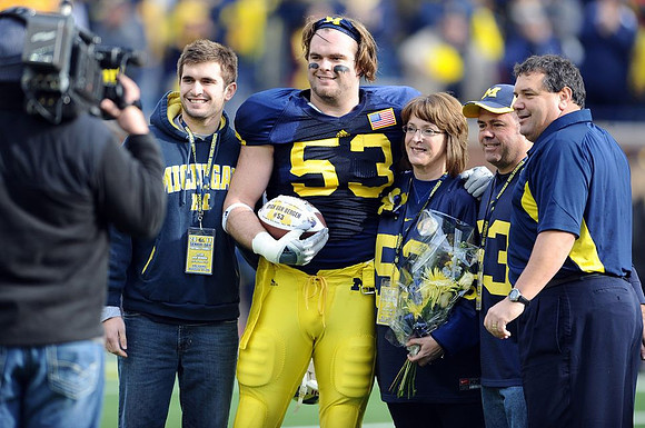 Ryan Van Bergen (53) and Brady Hoke