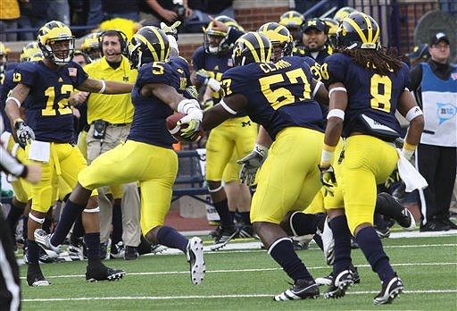 Roy Roundtree (12), Courtney Avery (5), Frank Clark (57), and J.T. Floyd (8)