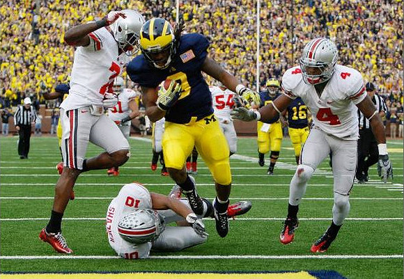 Martavious Odoms (9) and Denard Robinson (16)