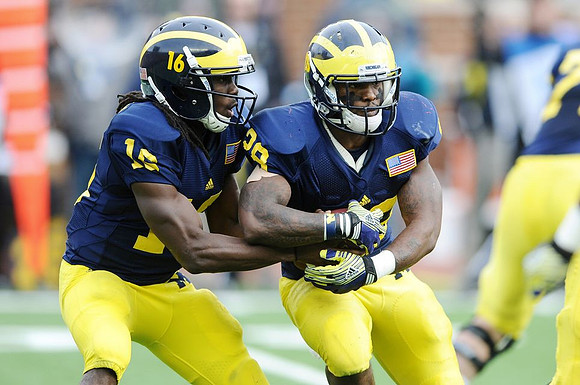 Denard Robinson (16) and Fitzgerald Toussaint (28)