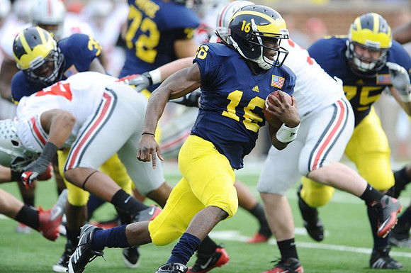 Stephen Hopkins (33), Mark Huyge (72), Denard Robinson (16), and Michael Schofield (75)