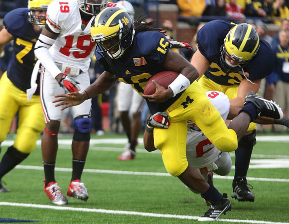 Michael Schofield (75), Denard Robinson (16), and Mark Huyge (72)
