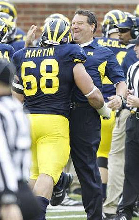 Mike Martin (68) and Brady Hoke