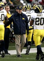 Lloyd Carr, Obi Oluigbo, Chad Henne, and Michael Hart