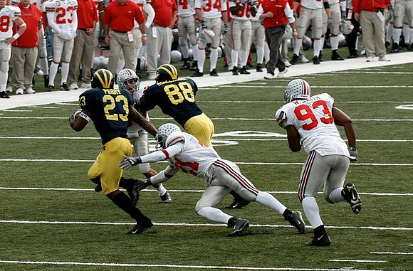 Chris Perry (23) and Tim Massaquoi (88)