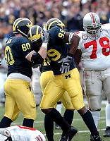 Pierre Woods (99) and Grant Bowman (6)