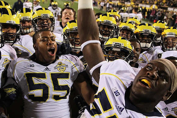 Jibreel Black (55) and Michigan Team