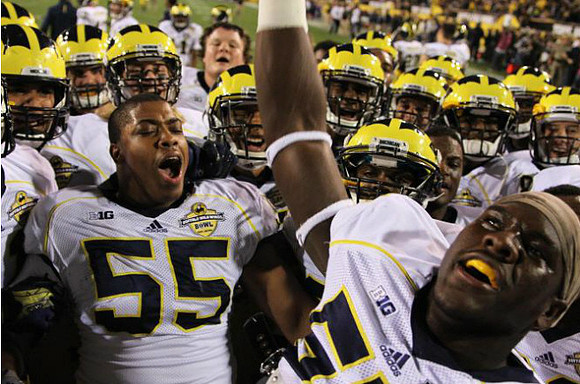 Jibreel Black (55) and Michigan Team