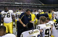 Quinton Washington (76), Mario Ojemudia (53), Alex Mitropoulos-Rundus (91), Brady Hoke, Brennen Beyer (97), Tom Strobel (50), Joe Kerridge (36), and Joe Bolden (35)