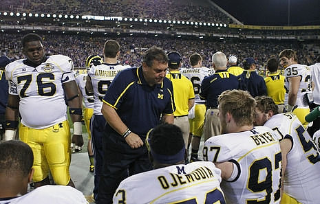 Quinton Washington (76), Mario Ojemudia (53), Alex Mitropoulos-Rundus (91), Brady Hoke, Brennen Beyer (97), Tom Strobel (50), Joe Kerridge (36), and Joe Bolden (35)
