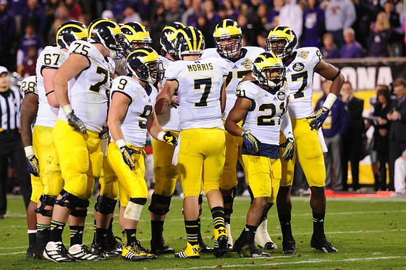 Fitzgerald Toussaint (28), Michael Schofield (75), Drew Dileo (9), Shane Morris (7), Taylor Lewan (77), Jeremy Gallon (21), and Devin Funchess (87)