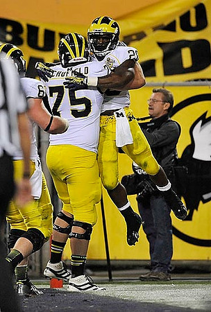 Michael Schofield (75) and Fitzgerald Toussaint (28)