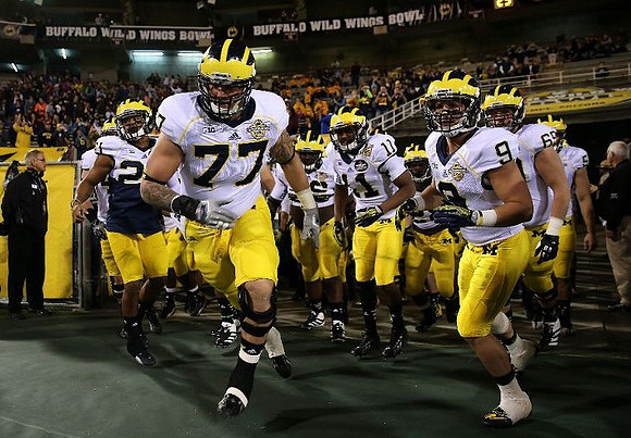 Jeremy Gallon (21), Taylor Lewan (77), Courtney Avery (11), Drew Dileo (9), and Willie Henry (69)