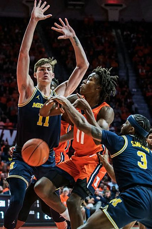 Colin Castleton (11) and Zavier Simpson (3)