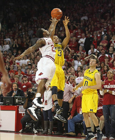 Trey Burke (3) and Zack Novak (0)