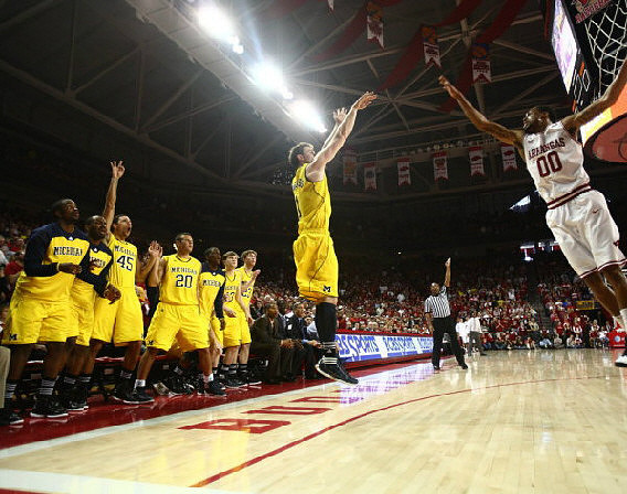 Evan Smotrycz (23) and Michigan Team