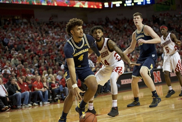 Isaiah Livers (4) and Jon Teske (15)