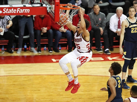 Jordan Poole (2) and Duncan Robinson (22)