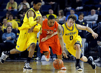 Darius Morris (4) and Zack Novak (0)