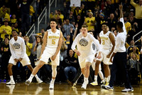 Aubrey Dawkins (24), D.J. Wilson (5), Moritz Wagner (13), Kameron Chatman (3), and Caris LeVert (23)