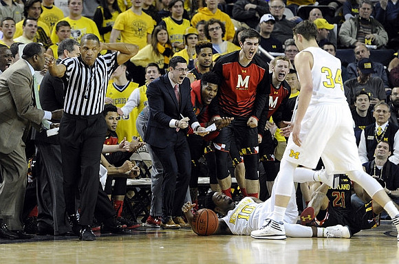 Derrick Walton Jr. (10) and Mark Donnal (34)