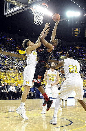 D.J. Wilson (5), Duncan Robinson (22), and Zak Irvin (21)