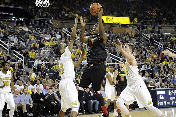 Derrick Walton Jr. (10), Muhammad-Ali Abdur-Rahkman (12), Aubrey Dawkins (24), and Mark Donnal (34)