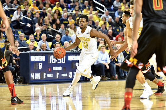 Derrick Walton Jr. (10) and D.J. Wilson (5)