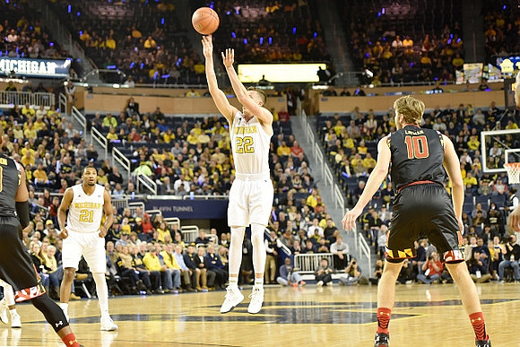 Zak Irvin (21) and Duncan Robinson (22)