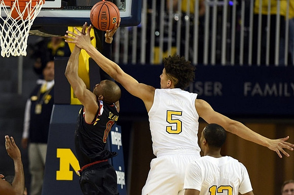 D.J. Wilson (5) and Muhammad-Ali Abdur-Rahkman (12)