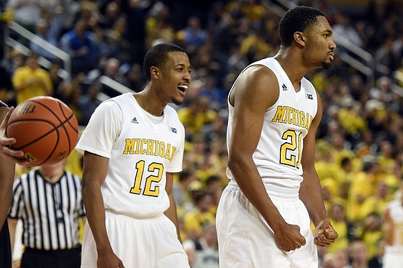 Muhammad-Ali Abdur-Rahkman (12) and Zak Irvin (21)