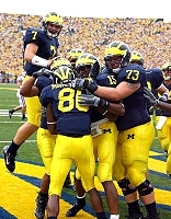 Mario Manningham, Chad Henne, Steve Breaston, and Alex Mitchell