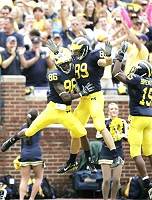 Mario Manningham, Tyler Ecker, and Steve Breaston