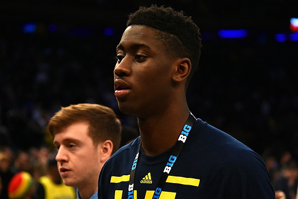 Spike Albrecht (2) and Caris LeVert (23)