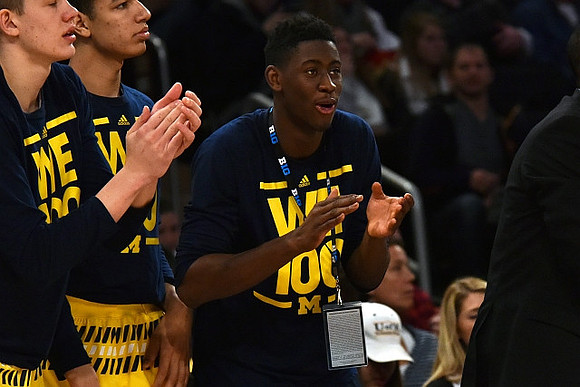 Moritz Wagner (13), D.J. Wilson (5), and Caris LeVert (23)