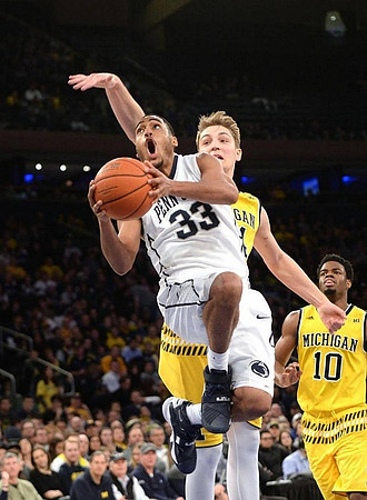Mark Donnal (34) and Derrick Walton Jr. (10)
