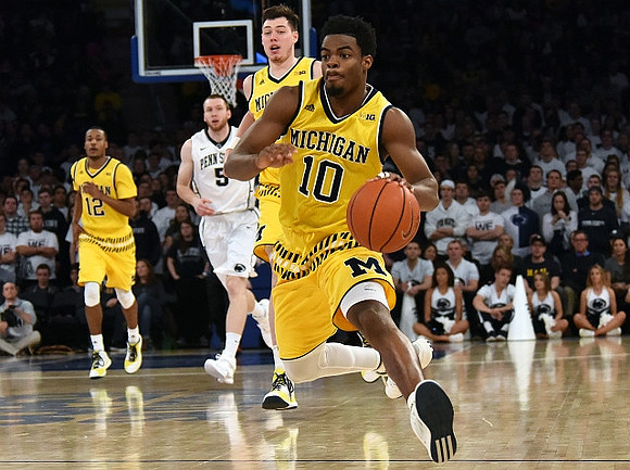 Muhammad-Ali Abdur-Rahkman (12), Ricky Doyle (32), and Derrick Walton Jr. (10)