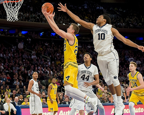 Derrick Walton Jr. (10), Duncan Robinson (22), and Mark Donnal (34)