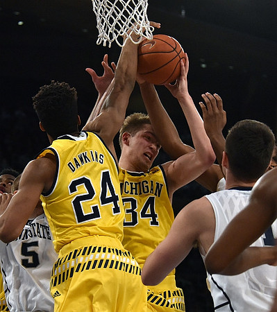 Aubrey Dawkins (24) and Mark Donnal (34)
