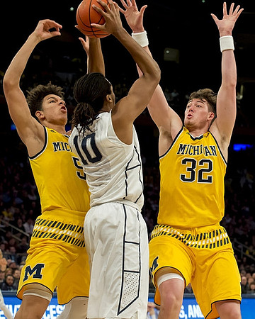 D.J. Wilson (5) and Ricky Doyle (32)